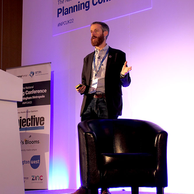 Speaker at National Planning Conference stood on a stage