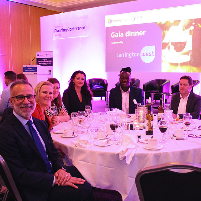 Six speakers at National Planning Conference enjoying a gala dinner sat at a round table