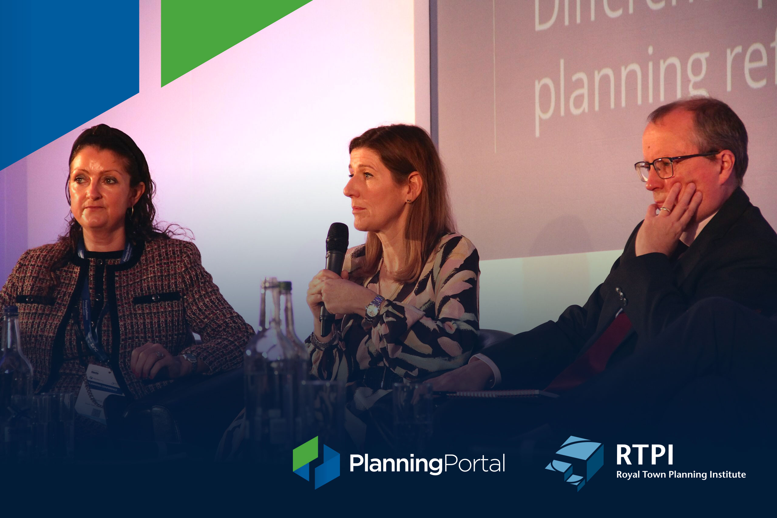 Three National Planning Conference speakers, presenting a panel on-stage, seated with microphones, facing forwards